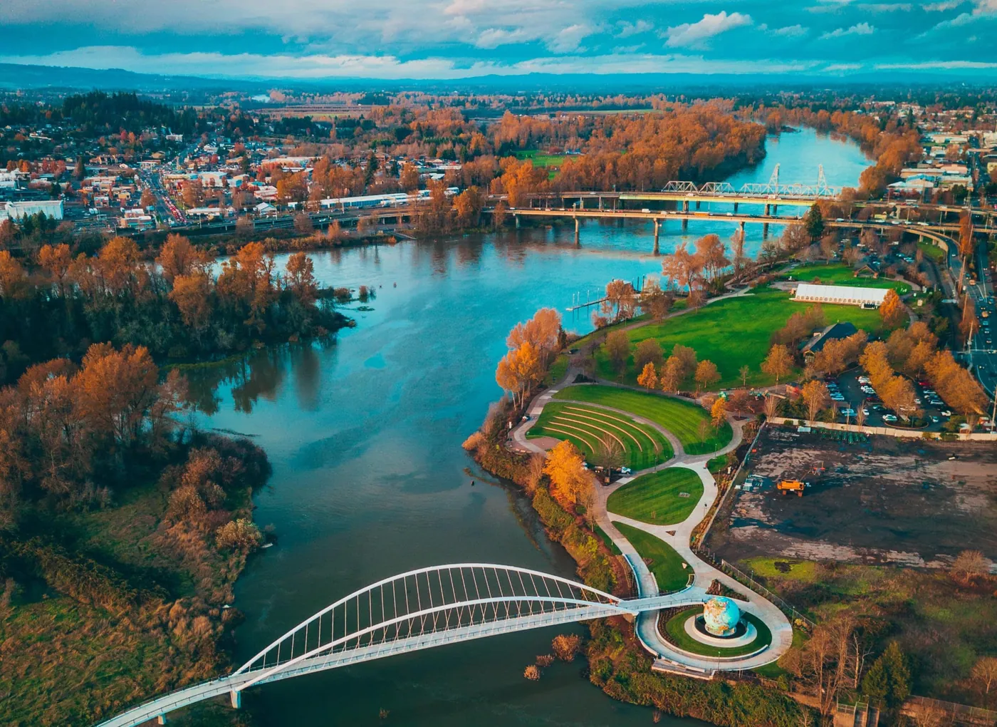 Aerial view of the Willamette River, Riverfront Park, and the pedestrian bridge in Salem, Oregon